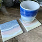 Sandy Beach with Blue and Pink Ocean Waves Coasters