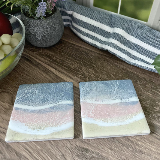 Sandy Beach with Blue and Pink Ocean Waves Coasters